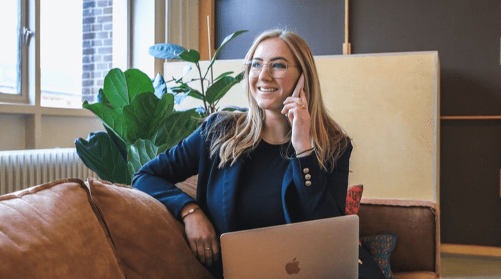 Woman having a call in a sofa